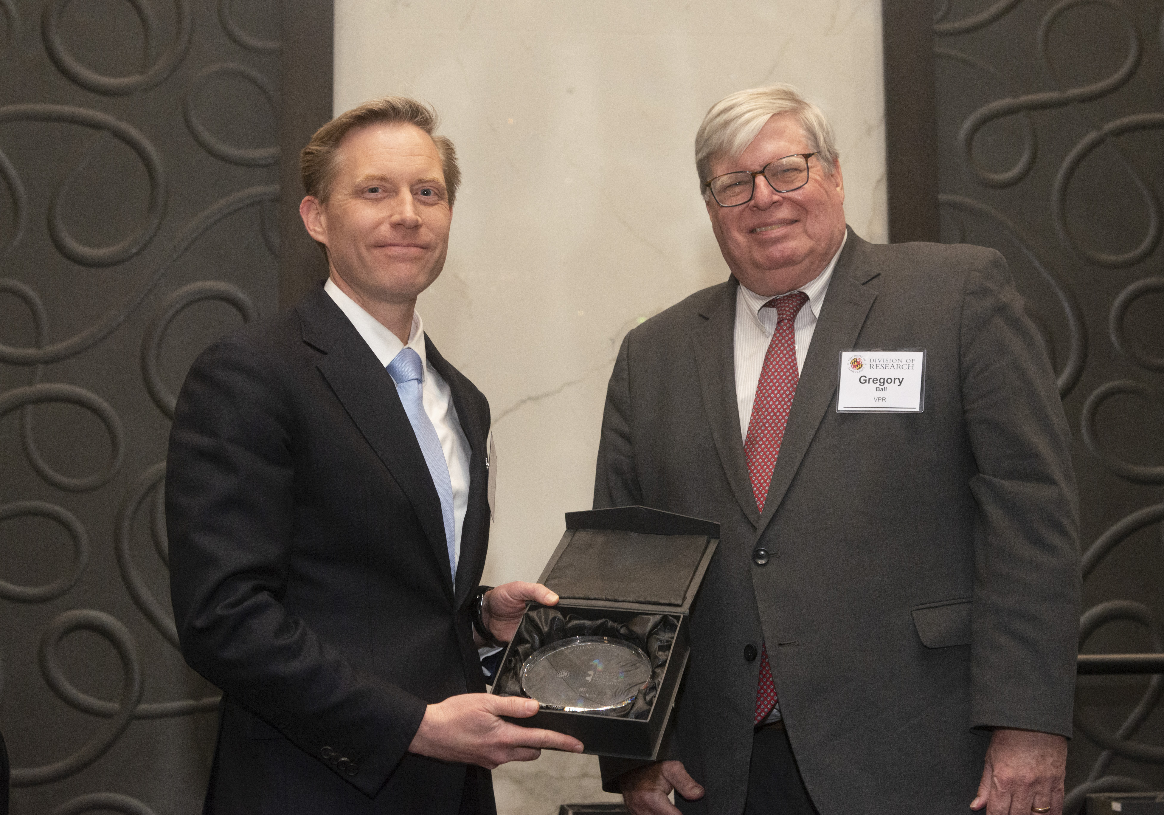 Nathan Hultman receives award from VPR Gregory Ball