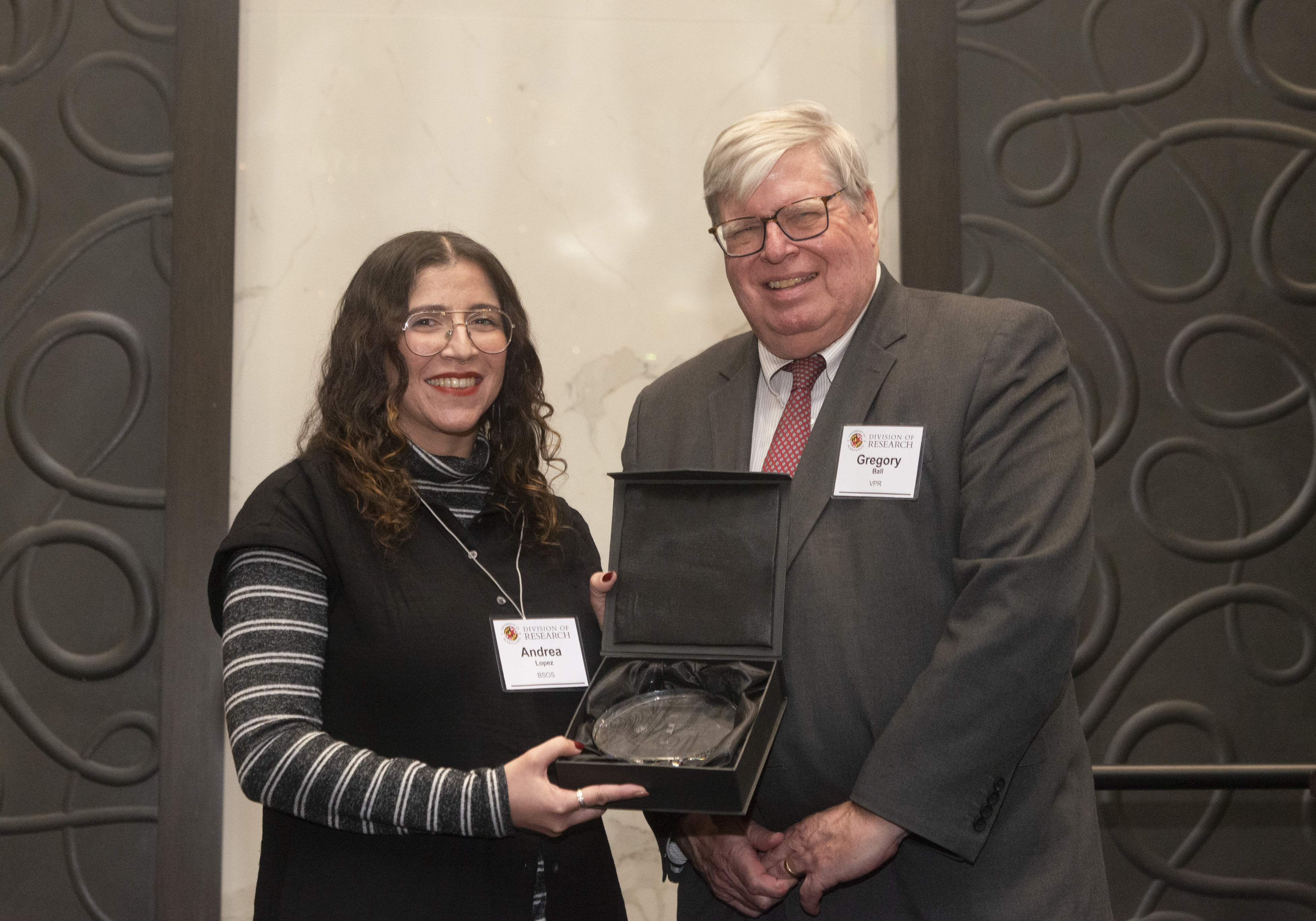 Andrea Lopez receives award from VPR Gregory Ball