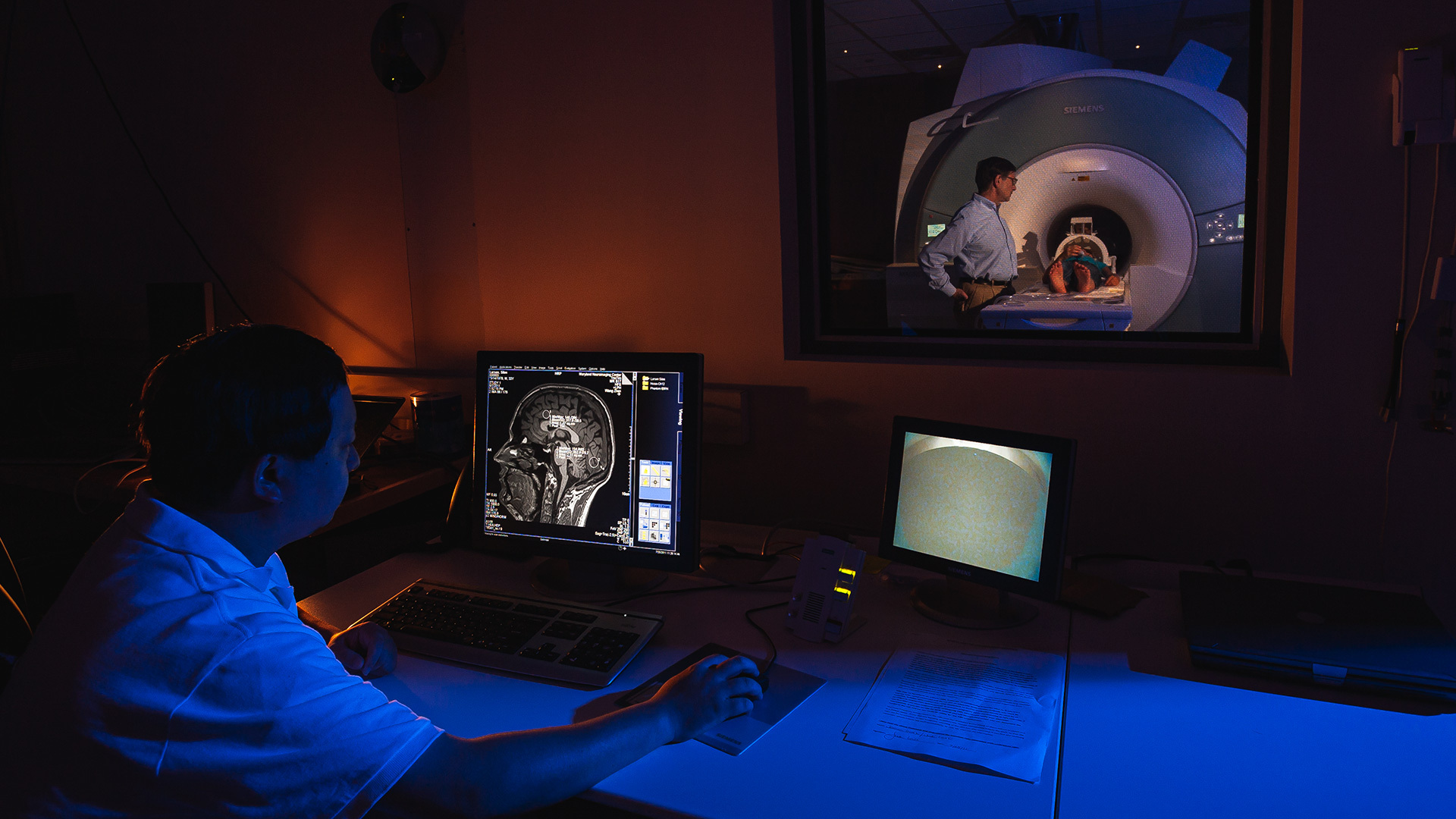 Researchers and technicians scan a patient's brain using fMRI technology at the Maryland Neuroimaging Center. Photo by John T. Consoli.