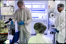 Specialist in clean suits and lab coats in a lab at the Micro & Nano Fabrication Laboratory 