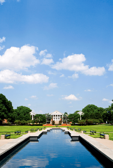 An almost mirror like surface of ODK Fountain at McKeldin Mall looking towards McKeldin Library