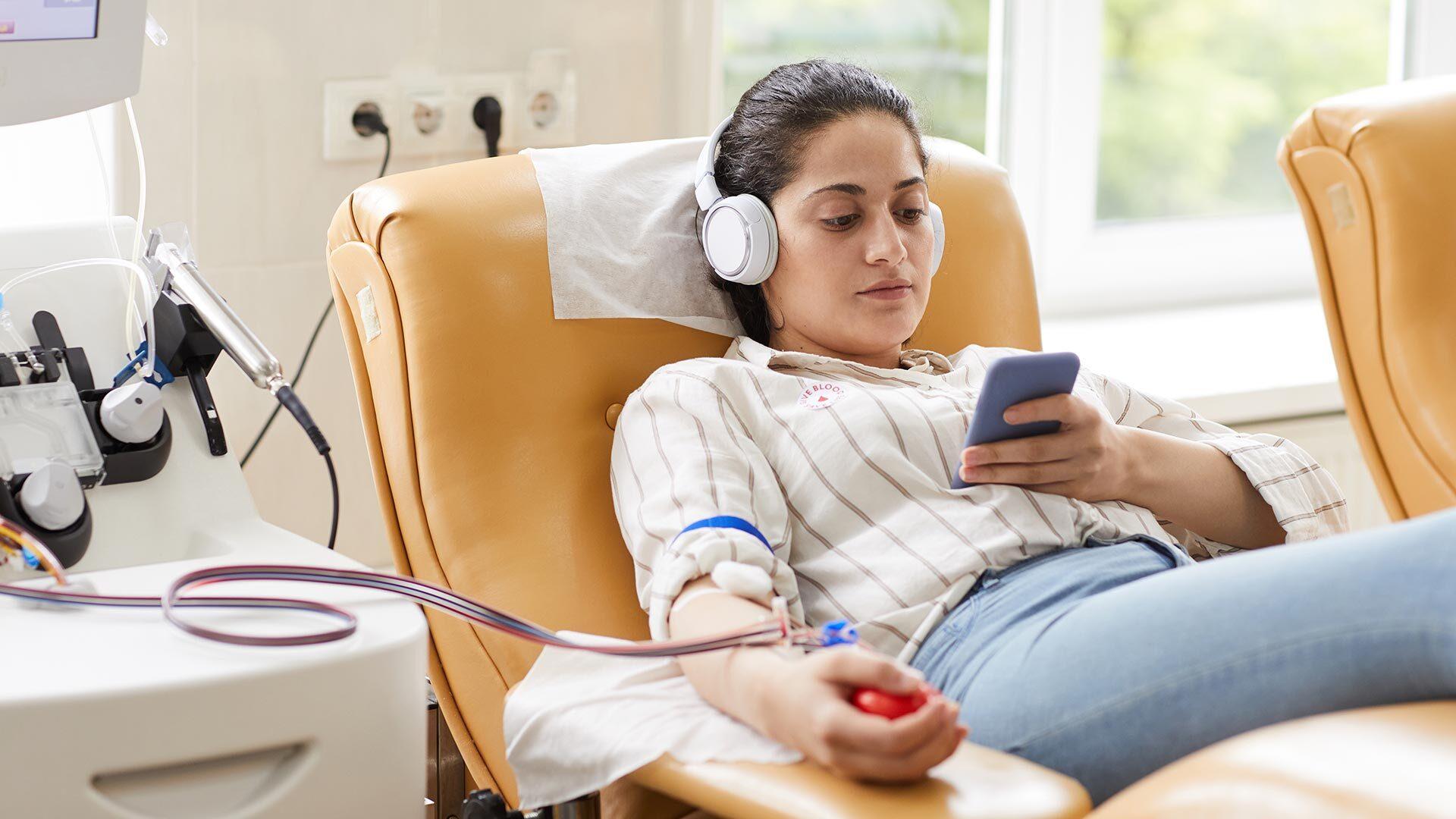 Girl giving blood donation