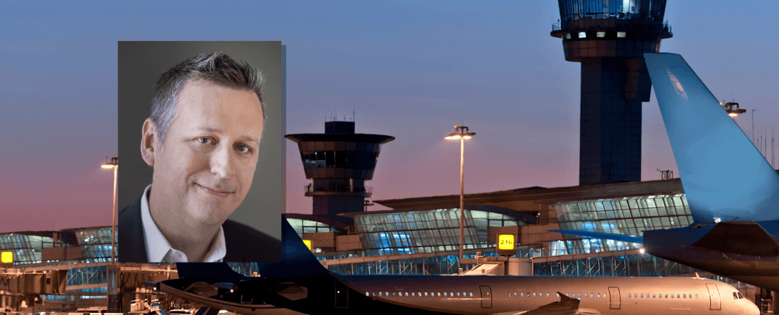 Charles Harry headshot on backdrop of an airport