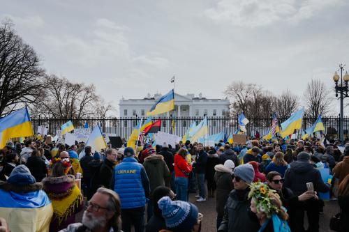 Crowd holding up Ukrainian flags outside White House